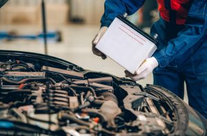 Mechanic changing car battery | Frederick, MD