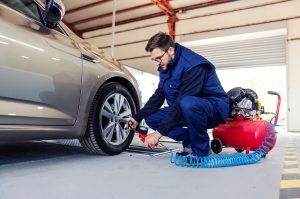 Mechanic putting air in tire | Frederick, MD